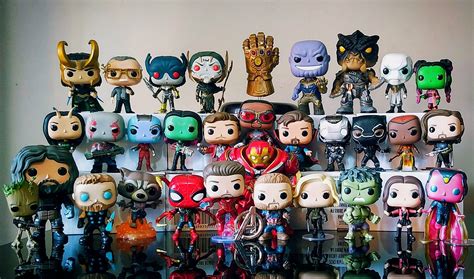 A collection of Marvel Funko Pops displayed on shelves